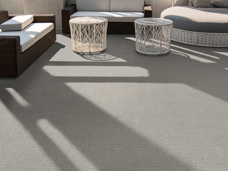 Outdoor terrace area with grey floor tile with sitting area